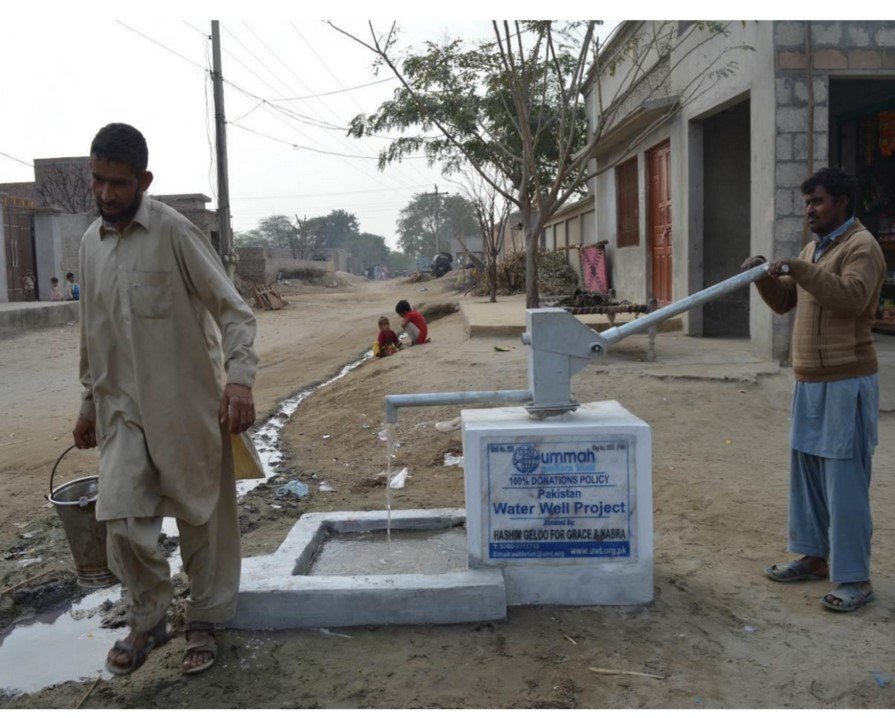 A completed Waterfalls hand pump in daily use in a Pakistani village