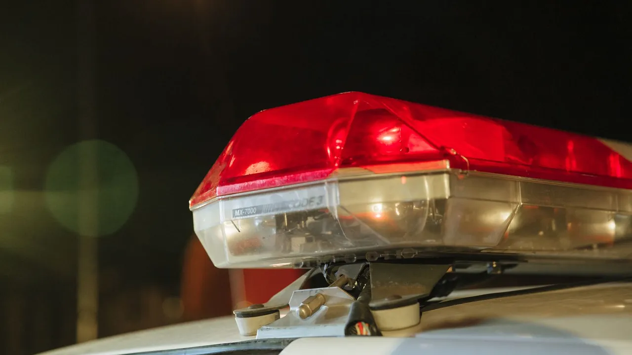 Police light bar lit at night on a patrol car, how most Virginia reckless driving charges begin